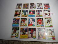 Top-down image of 20 1980-81 O-Pee-Chee hockey cards arranged in rows, showing color front player images and team names with white borders and rounded edges.