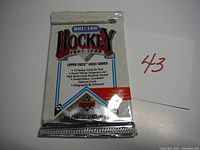 Front of sealed 1991-1992 Upper Deck NHL Hockey card pack showing branding, card count, holographic enhanced note