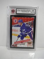 Front of encapsulated card showing Auston Matthews in Toronto Maple Leafs uniform and grade label