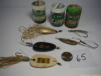 Photo showing the collection of three jars of Uncle Josh pork bait and six fishing lures including Weed Walkers and Moss Boss, all displayed on a surface.
