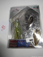 R2S Crystal Spin spinnerbait fishing lure packaged, showing the lure with chartreuse skirt and two spinner blades, weight 5/8 oz, color sp02 chartreuse shad