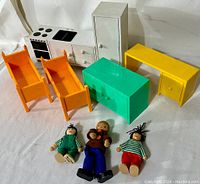 Photo showing all items in the lot including the IKEA toy furniture and dolls.