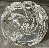 Side/top angled view illustrating the heavy bulbous shape and swirling glass pattern.