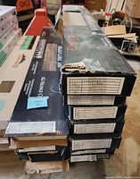 Stack of 15+ boxes of vinyl flooring