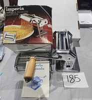 Imperia pasta maker machine with crank and original box, including user manual.