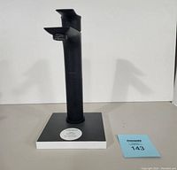 Matte black single handle tall lavatory faucet shown on a black and white display block with label GA12H-MB. Faucet has a square spout and modern design.