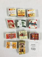 Photo showing multiple bundles of Canadian New Year's stamps with rubber bands and paper bands labeled with numbers.