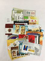 Lot of assorted Canadian First Day Covers arranged flat showing varied stamp designs and colorful artistic covers.