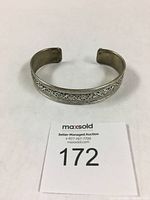 Front view of vintage Tibetan filigree silver bracelet showing detailed wire work.