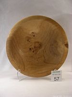 Front view of large turned Garry Oak wooden bowl showing natural wood grain and knots.
