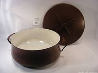 Brown Dansk stock pot with white interior enamel and lid next to it
