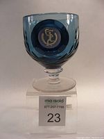 Front view of blue Wedgwood crystal goblet with Olympic torch runner medallion.