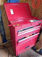 Front view of red Job Mate tool box with top lid open