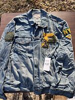 Front view of Ralph Lauren denim jacket with patches