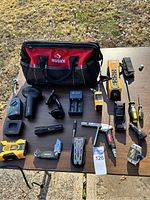 Overview of all items including Husky tool bag and various tools and electronics
