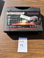 Closed carrying case showing High Power multi-function jump starter label with key features.