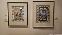 Two framed East Indian art prints hanging on wall, showing traditional Indian scenes in detailed artwork with decorative borders.