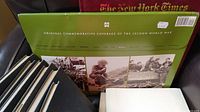 Green box set with war photographs and text 'Original Commemorative Coverage of the Second World War'