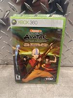 Front cover of sealed Avatar The Last Airbender The Burning Earth Xbox 360 game case.