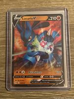 Photo of a Lucario V rare holographic Pokémon card from the Sword & Shield series.