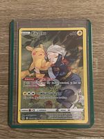 Photo of Pikachu full art Pokémon trading card showing front artwork and text.