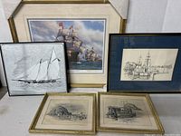 Photo showing all five framed nautical art pieces together with varied sizes and frame styles.