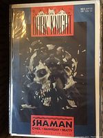 Front cover of the comic showing Batman in dark tones with skulls and the title 'Legends of the Dark Knight' No. 5 March 1990 in plastic sleeve.