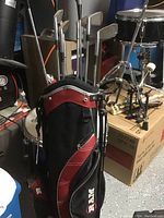 Overview of RAM branded golf bag filled with multiple golf clubs.