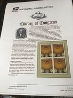 Sheet of four unopened 33-cent stamps commemorating the Library of Congress dome, sealed with background historical info.