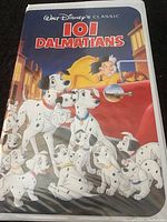Front cover art of the VHS case showing the 101 Dalmatians characters and villain Cruella de Vil.