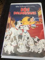 Front cover of the VHS tape sleeve showing 101 Dalmatians characters and film title.