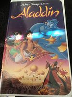 Front cover of the VHS case showing Aladdin movie artwork and title