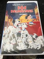 Front cover of the VHS case depicting the 101 Dalmatians characters and villain Cruella de Vil