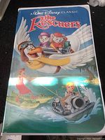 Front cover of the VHS tape showing illustrated characters from the movie The Rescuers by Walt Disney.