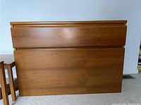 Front view of Danish teak storage console showing three drawers and clean minimalist design.