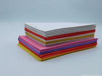 Top stacked view of assorted colored envelopes showing white, red, purple, pink, and yellow colors in two different sizes.