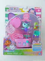Front view of unopened Gabby's Dollhouse MerCat Playset in branded packaging showing figure, accessories, and labels.