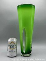 Tall bright green tapered glass vase with clear elongated cut-out accents displayed next to a soda can for size reference. Vase is approximately 14 inches tall, handmade, heavy glass.