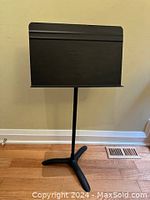 Full view of the Manhasset Symphony adjustable music stand, showing tripod base and music desk.
