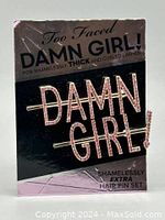 Hair pins displayed on original Too Faced branded packaging with 'DAMN GIRL!' text and product information.