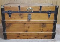 Front view showing wood panel planking, central latch and brass-tone plate