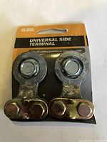 Pair of universal side terminal battery connectors on original packaging card, showing brand ILINK and product text.