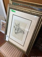 Framed horse head pencil drawing with signature, shown from an angle to capture frame and matting details.
