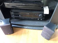 Pioneer Blu-ray player stacked on Yamaha AV receiver with two Yamaha satellite speakers and Toshiba speaker in front, showing the full lot.