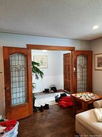 Pair of stained glass French doors installed in opening