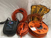 Full view of all items including battery charger, extension cords, and file set.