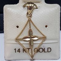 Front view of the 14K yellow gold pendant on a textured white card with the label '14K GOLD'.