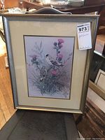 Framed goldfinch bird print showing two birds perched on plants with pink flowers, matted and framed under glass.