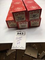 Five red QRS piano roll boxes arranged with visible labels against white background.