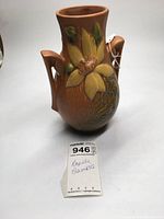 Full view of Roseville Clematis vase showing front floral design and handles